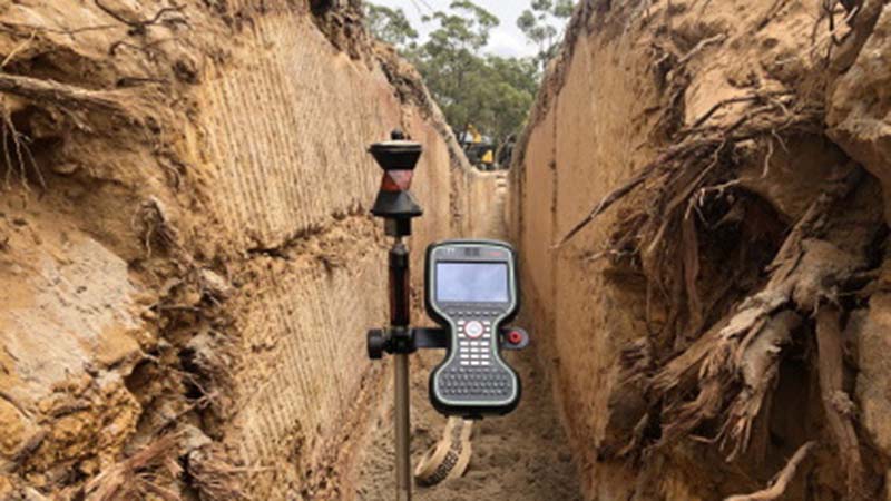 Survey data collector in trench excavation